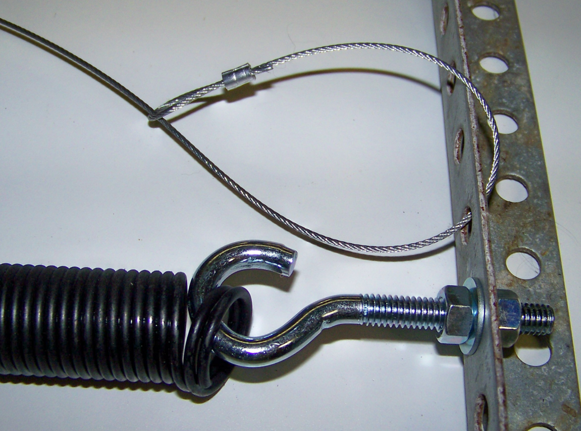 a professional technician repairing a garage door spring in Cape Coral, FL, highlighting the expertise and quality services provided by Garage Door Repair Cape Coral FL.